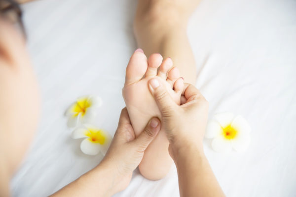 woman-receiving-foot-massage-service-from-masseuse-close-up-at-hand-and-foot-relax-in-foot-massage-therapy-service-concept